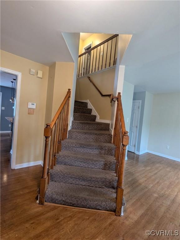 3900 Elmswell Dr, Richmond, VA 23223 - staircase with baseboards and wood finished floors