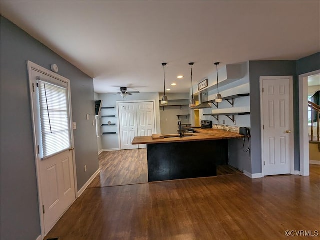 3900 Elmswell Dr, Richmond, VA 23223 - kitchen featuring a ceiling fan, baseboards, wooden counters, dark wood finished floors, and a peninsula