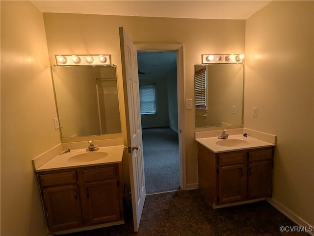 3900 Elmswell Dr, Richmond, VA 23223 - bathroom featuring baseboards, two vanities, and a sink