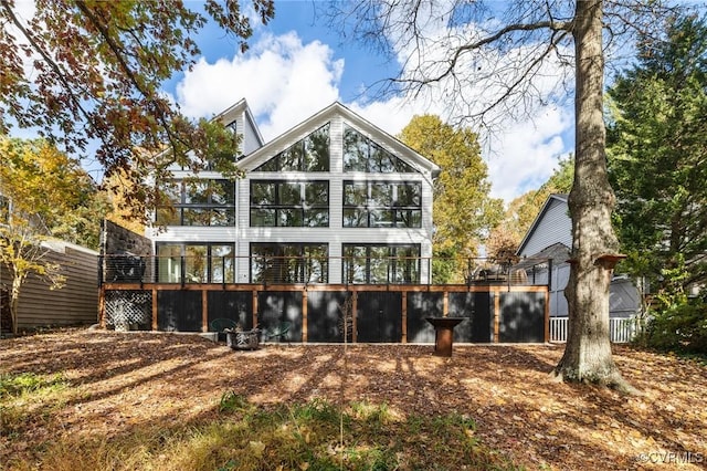 back of house featuring a sunroom