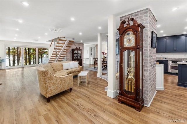 interior space with recessed lighting, light wood-style flooring, and stairs