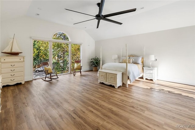 bedroom featuring baseboards, ceiling fan, wood finished floors, and lofted ceiling