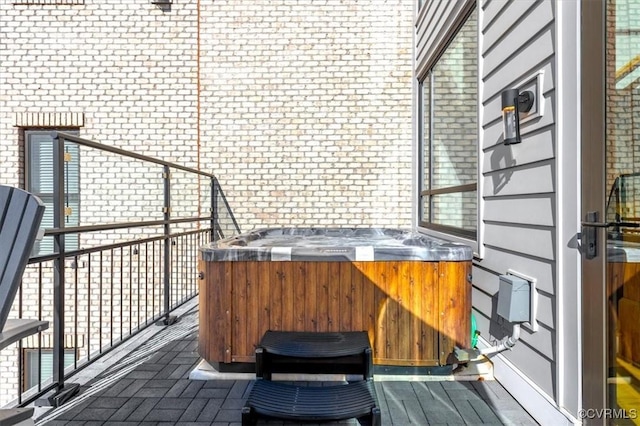 exterior space with a hot tub