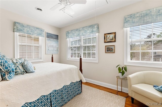 4708 Hanover Ave, Richmond, VA 23226 - bedroom with baseboards, multiple windows, wood finished floors, and attic access