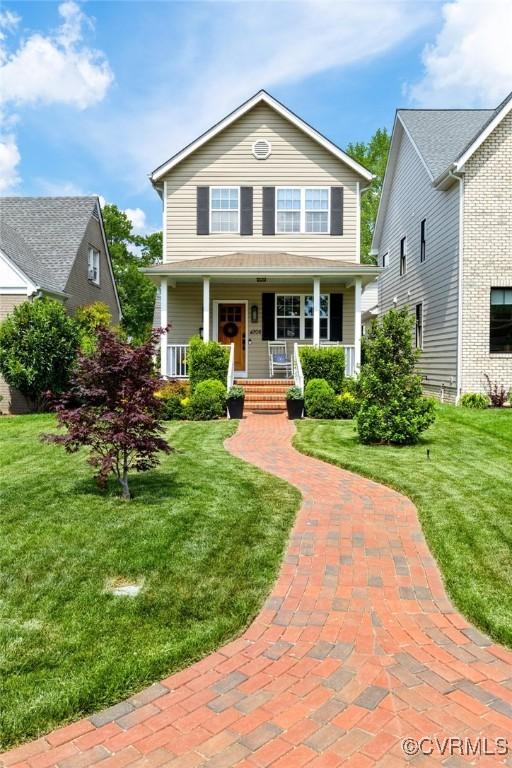 4708 Hanover Ave, Richmond, VA 23226 - traditional-style home featuring a front lawn and covered porch