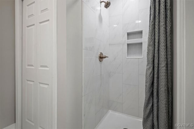 full bath featuring a shower stall