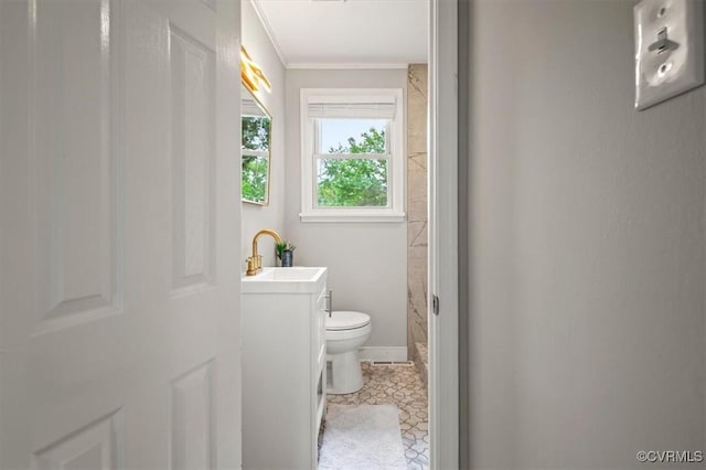 full bath with vanity, crown molding, and toilet