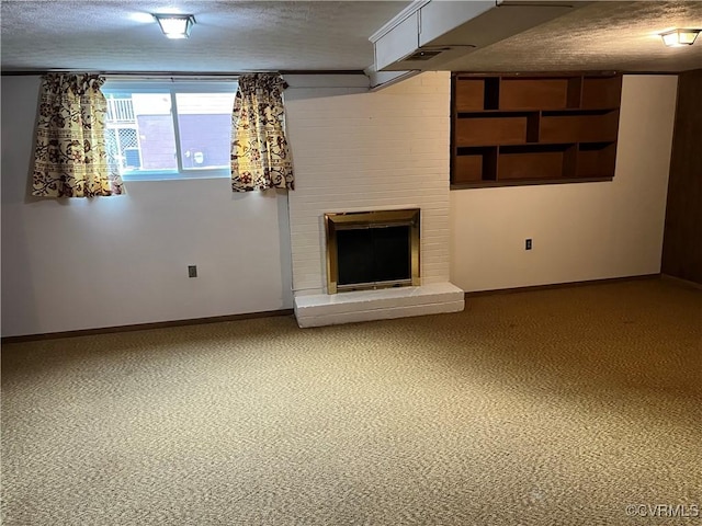 basement with a textured ceiling, baseboards, and a fireplace