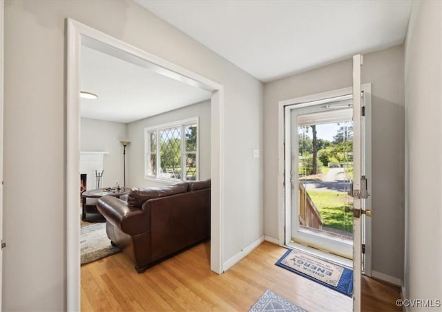 112 Webster Rd, Sandston, VA 23150 - entrance foyer featuring light wood finished floors, a lit fireplace, and baseboards
