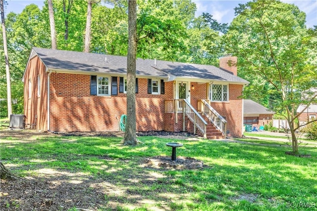 112 Webster Rd, Sandston, VA 23150 - ranch-style house featuring a chimney, brick siding, a front lawn, and central AC unit