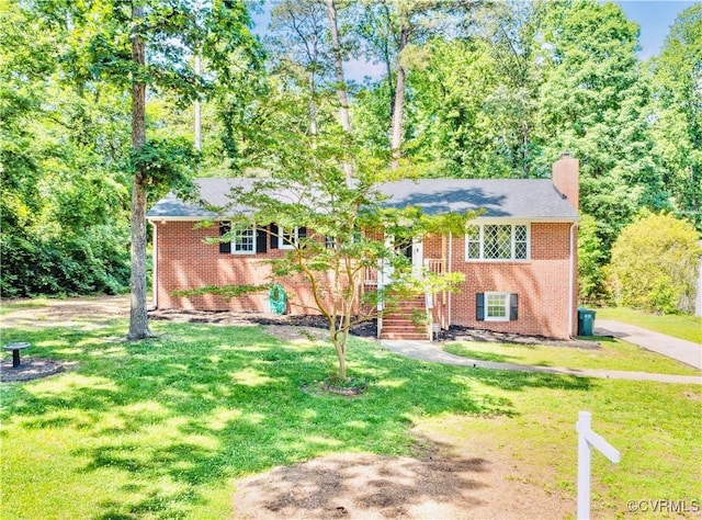 112 Webster Rd, Sandston, VA 23150 - view of front of house with brick siding, a front yard, a chimney, and stairway