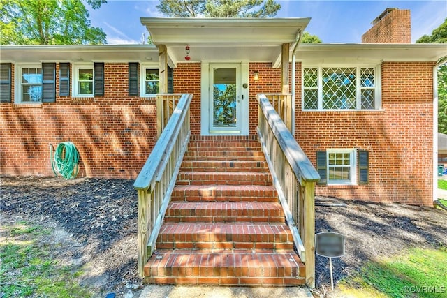 112 Webster Rd, Sandston, VA 23150 - doorway to property featuring brick siding and a chimney
