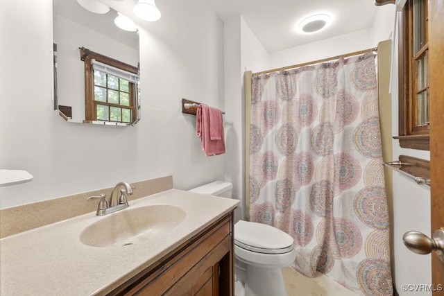 full bathroom with vanity, toilet, and a shower with shower curtain