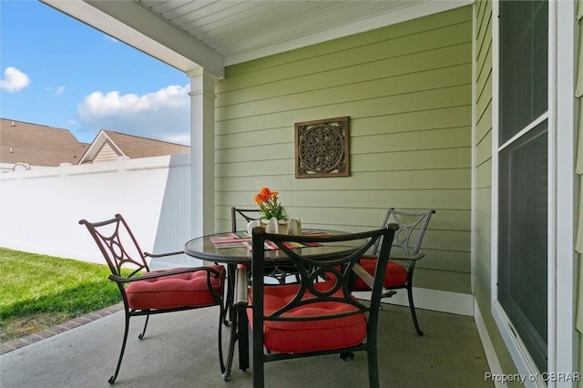 balcony with outdoor dining area
