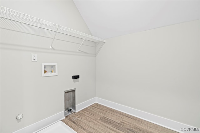 laundry area with laundry area, wood finished floors, baseboards, hookup for a washing machine, and electric dryer hookup