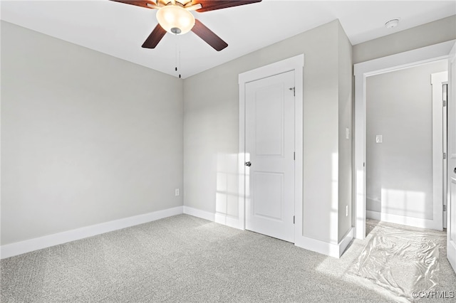 unfurnished bedroom with a ceiling fan, baseboards, and light carpet