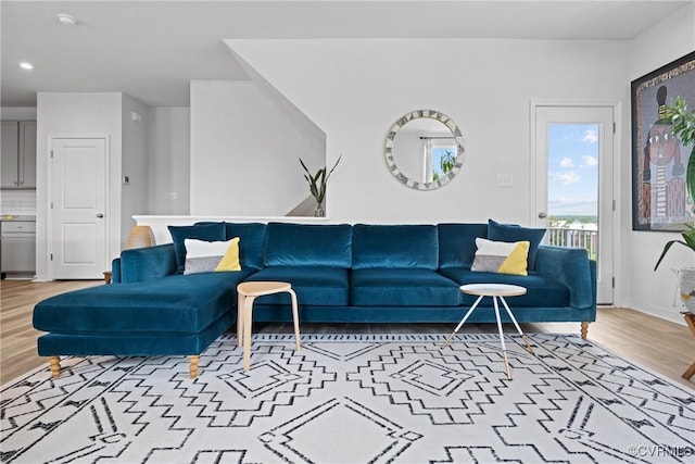 living area featuring recessed lighting and light wood-style flooring