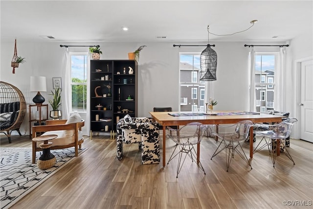 dining space featuring recessed lighting, visible vents, and light wood-style flooring