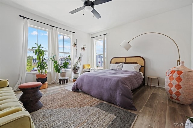 bedroom featuring ceiling fan and wood finished floors