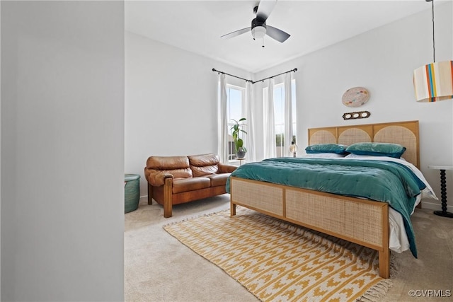 carpeted bedroom featuring a ceiling fan