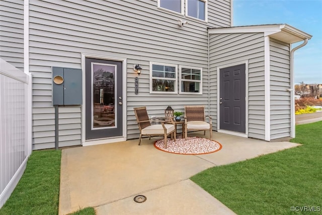 entrance to property with a patio