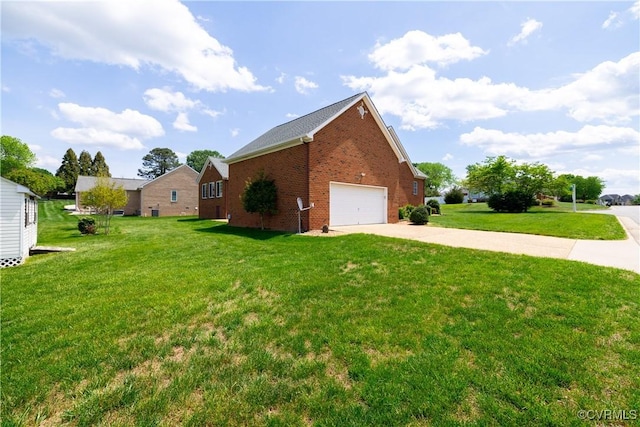view of side of property featuring a garage, a lawn, driveway, and brick siding