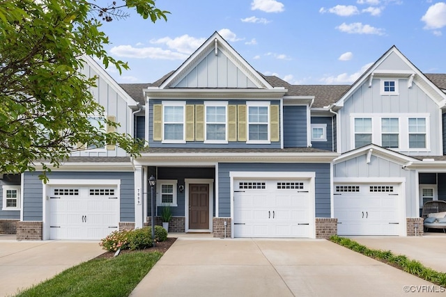 7009 Desert Candle Dr, Moseley, VA 23120 - view of front of property with a shingled roof, board and batten siding, and concrete driveway