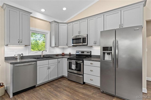 12421 Campbell Rd, Orange, VA 22960 - kitchen featuring dark countertops, tasteful backsplash, a sink, lofted ceiling, and stainless steel appliances