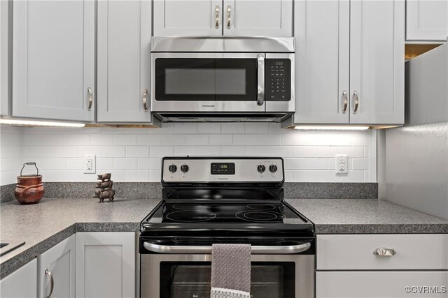 12421 Campbell Rd, Orange, VA 22960 - kitchen featuring decorative backsplash, appliances with stainless steel finishes, and dark countertops