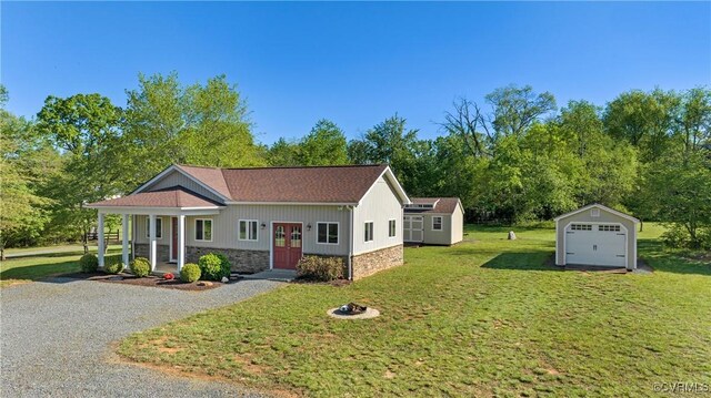 12421 Campbell Rd, Orange, VA 22960 - view of front facade featuring an outbuilding, a front yard, gravel driveway, and stone siding