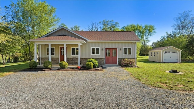 12421 Campbell Rd, Orange, VA 22960 - bungalow-style home with covered porch, driveway, a front yard, a garage, and an outdoor structure
