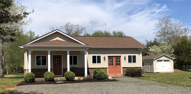 12421 Campbell Rd, Orange, VA 22960 - view of front of home with a porch, an outdoor structure, roof with shingles, and a detached garage