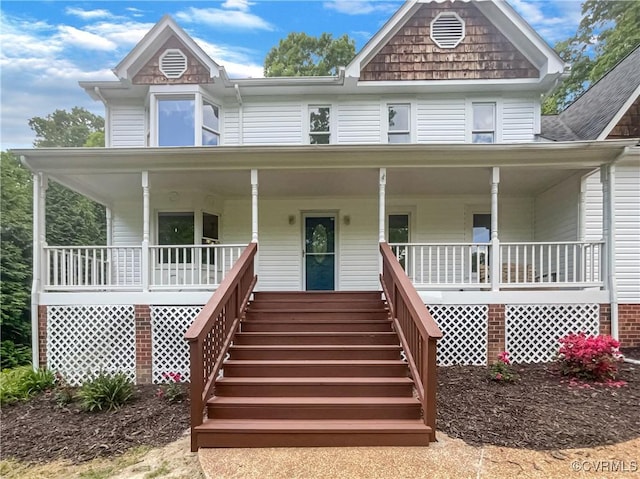 view of front facade with a porch and stairs