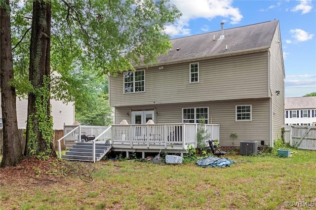 back of house featuring a wooden deck and central air condition unit