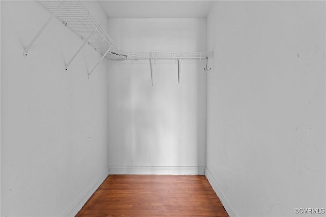 spacious closet with wood finished floors