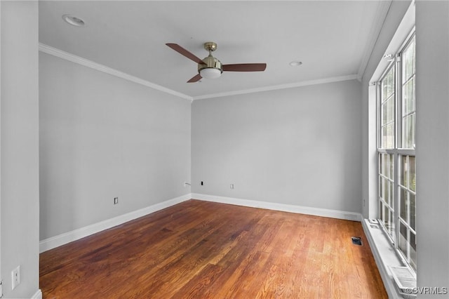 unfurnished room with a ceiling fan, baseboards, wood finished floors, crown molding, and recessed lighting
