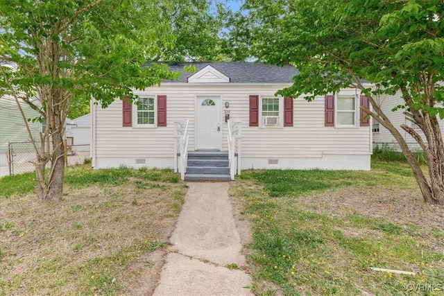 view of front of property featuring crawl space, fence, and a shingled roof
