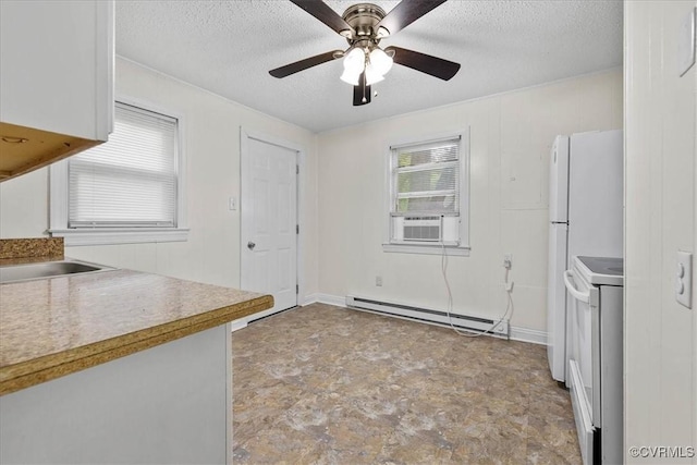 unfurnished dining area with a ceiling fan, a textured ceiling, cooling unit, and baseboard heating