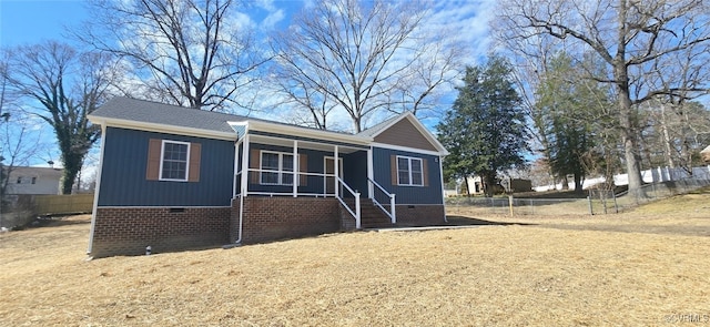 ranch-style house featuring fence, stairs, a porch, and crawl space