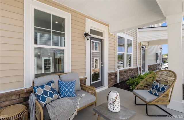 view of patio featuring covered porch and outdoor lounge area