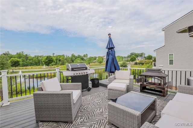 deck with a water view, outdoor lounge area, and a grill