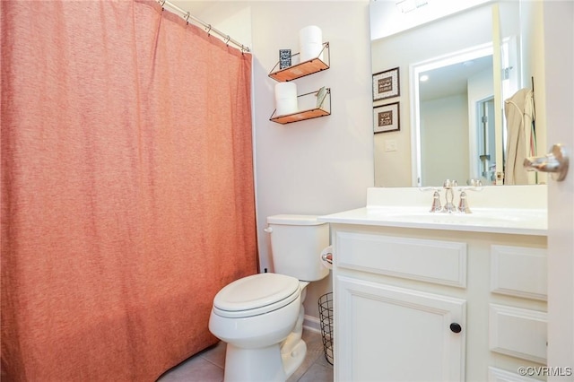 full bathroom featuring toilet, tile patterned floors, and vanity