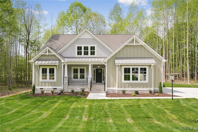craftsman-style house with a standing seam roof, board and batten siding, a porch, and roof with shingles
