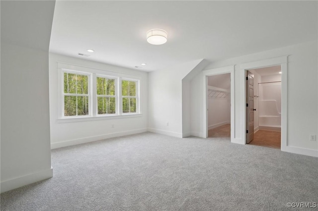 9088 Terroir Ln, New Kent, VA 23124 - unfurnished bedroom featuring carpet floors, baseboards, ensuite bathroom, a walk in closet, and recessed lighting