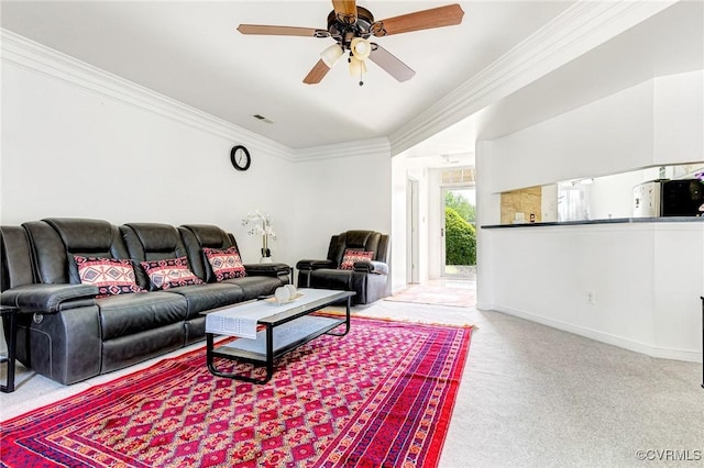 carpeted living room featuring crown molding, ceiling fan, visible vents, and baseboards