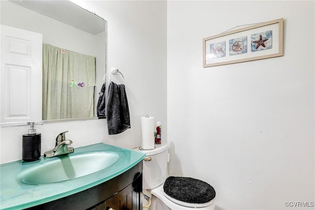 bathroom featuring vanity and toilet