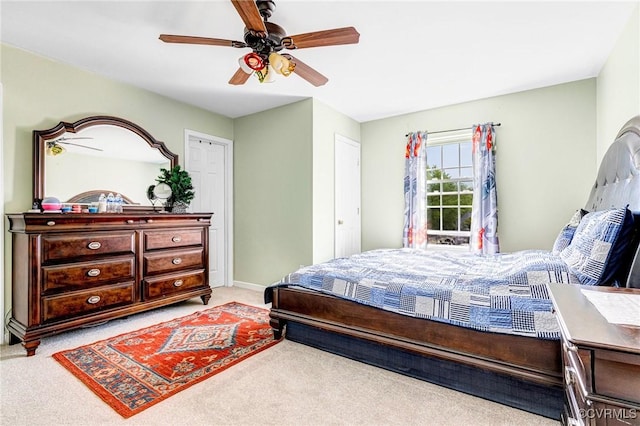 bedroom with carpet flooring, a ceiling fan, and baseboards