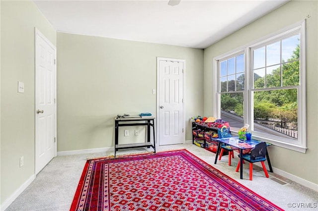 rec room with baseboards, carpet, and visible vents