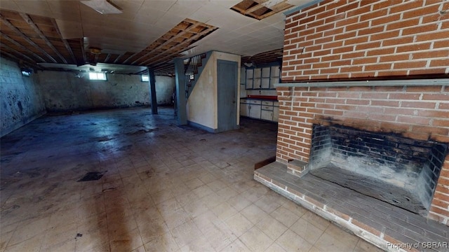 basement featuring stairs