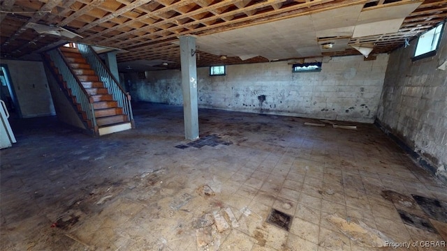 basement featuring stairs